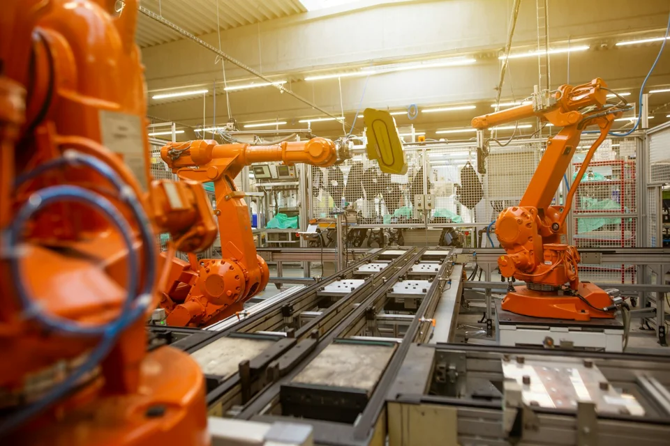 Robotic assembly equipment inside an automotive factory